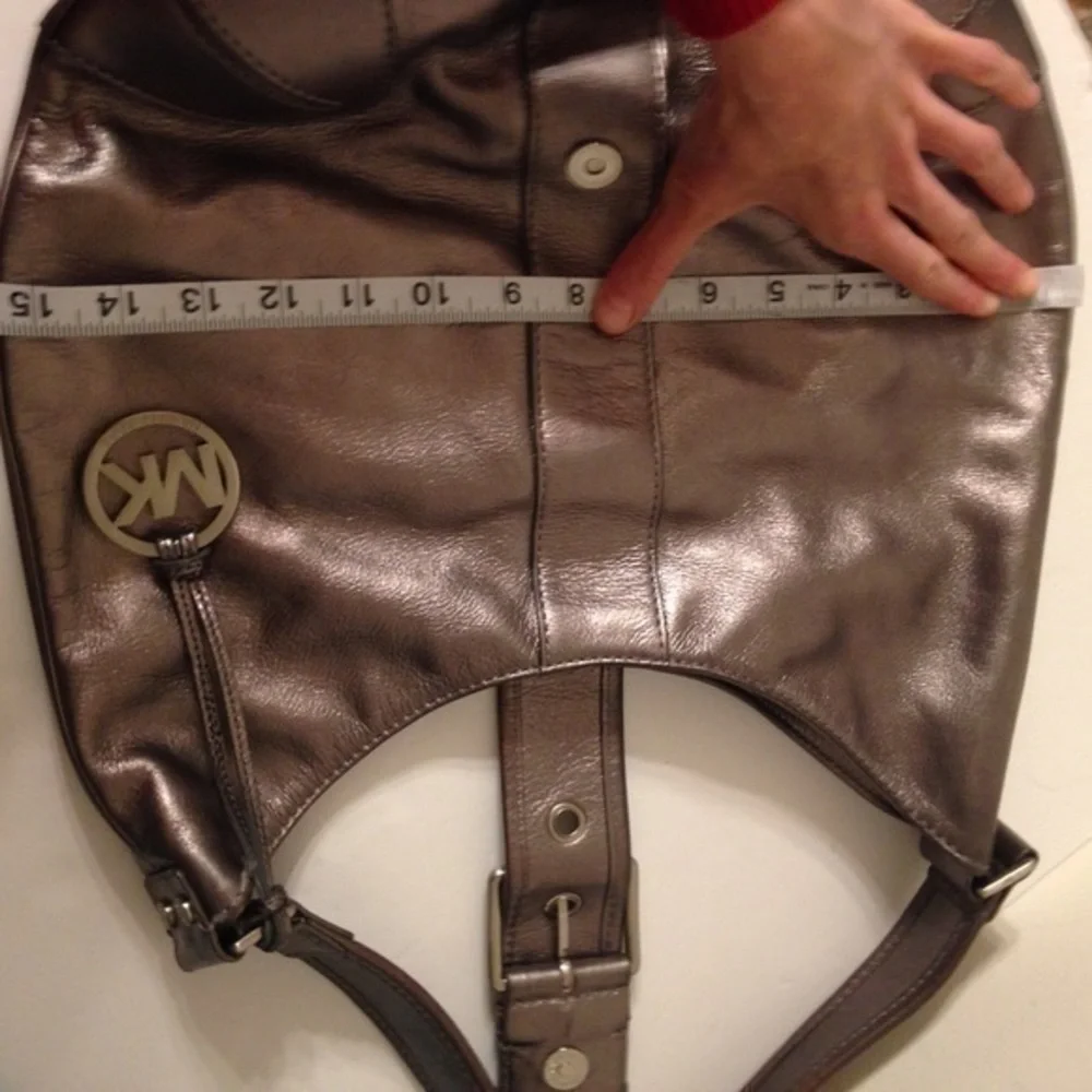 Michael Kors silver metallic hobo bag buckle